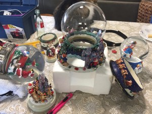 Pat Farley fixing snow globes